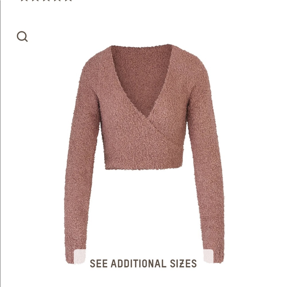 Skims cozy knit wrap top. Color: dusk (light pink)